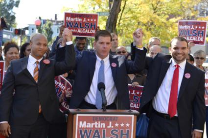 Team of Rivals: John Barros, left, and City Councillor Felix Arroyo, right, endorsed State Rep. Marty Walsh’s candidacy for mayor of Boston during a press conference in Egleston Square on Tuesday morning. Photo by Paul Marotta